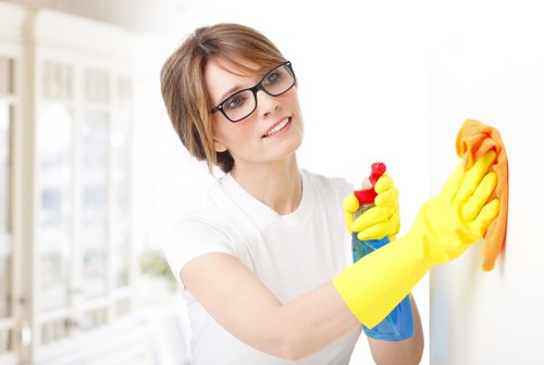 Technician explaining the cleaning booking process and service terms to a customer