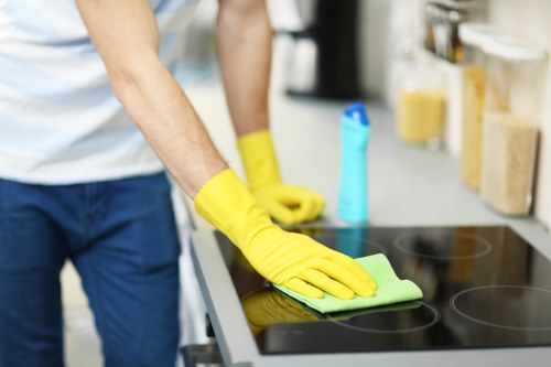 Professional cleaners working through a Brompton apartment before move out